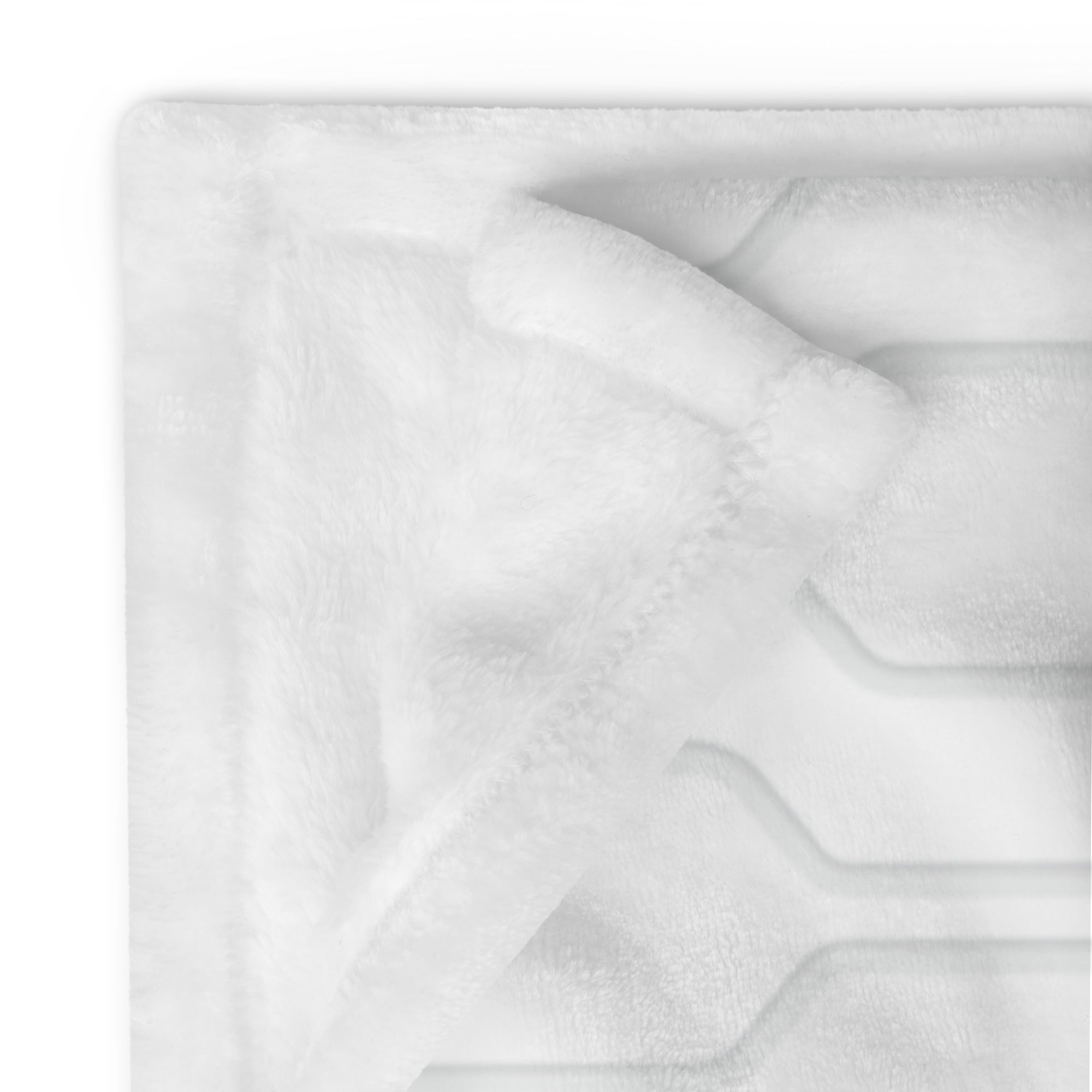 Detailed image of stitching and corner of personalized extra large blanket with light gray contemporary pattern. Blanket has text that says, "a hug from Melissa & Heather.” Farewell gift for moving away.