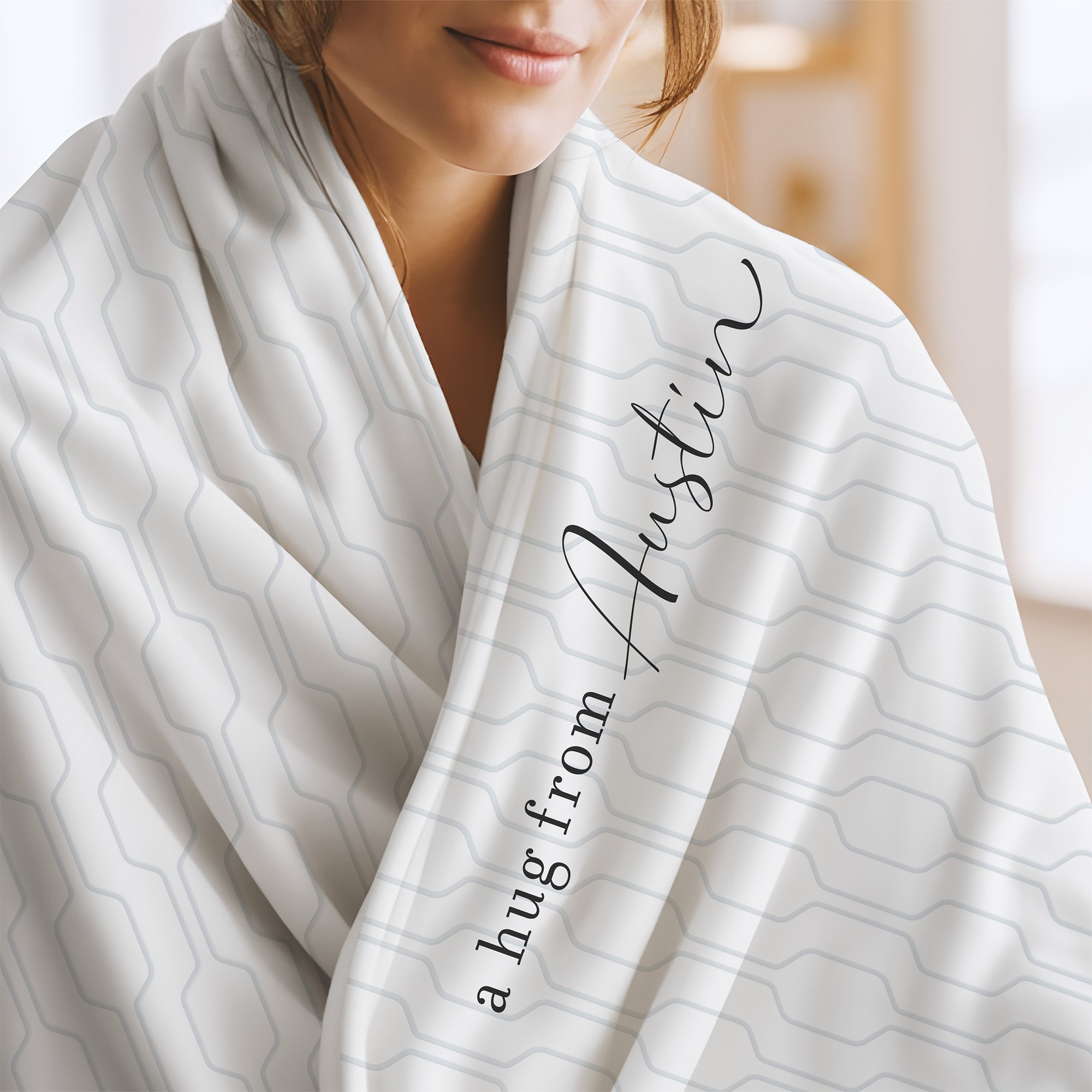 Send a hug extra soft blanket with white and blue mid century modern pattern and the words "a hug from Austin.” Get well gift for illness diagnosis.