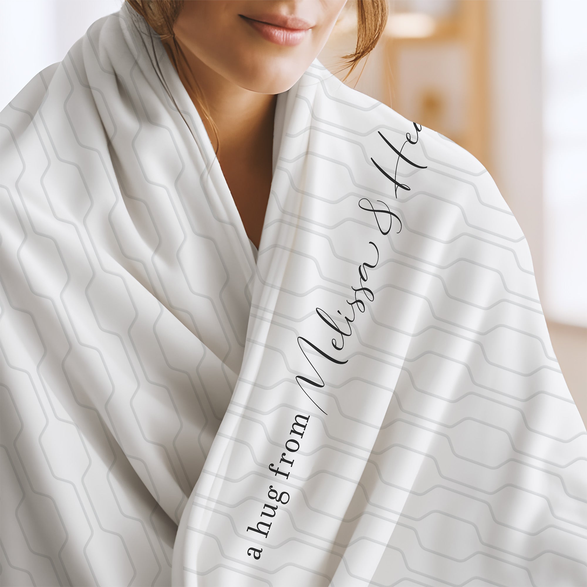 Send a hug extra soft blanket with white and gray geometric pattern and the words "a hug from Melissa & Heather.” Encouragement gift for divorce or trauma.