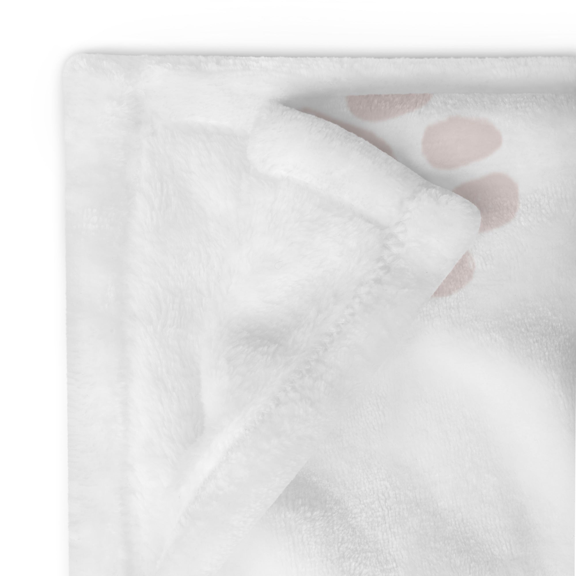 Detailed image of stitching and corner of personalize memorial blanket with light pink paw print pattern. Blanket has text that says, “snuggles from Millie.” Sympathy gift for dog or cat.
