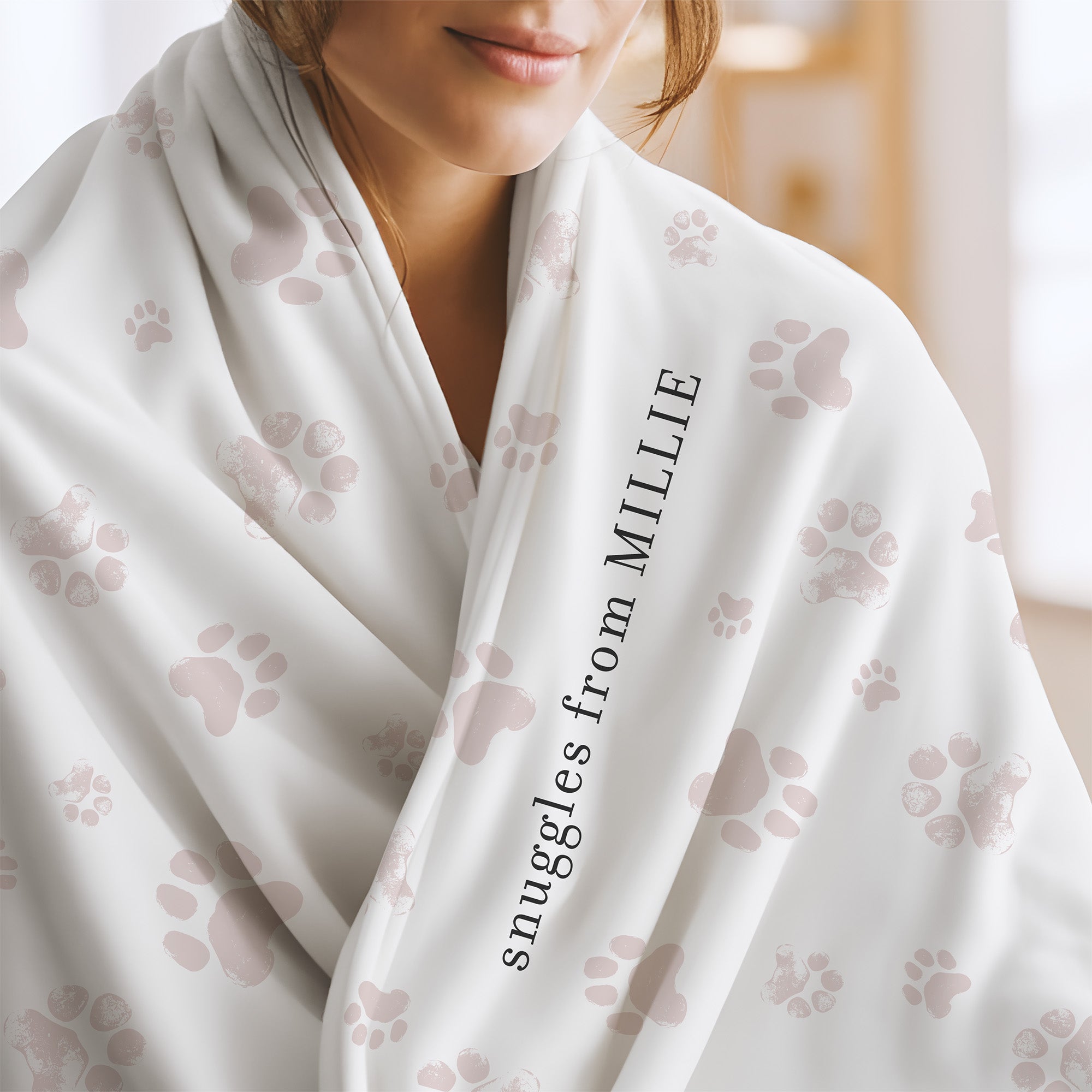 Send a hug memorial blanket with white and pink paw print pattern and the words "snuggles from Millie.” Sympathy gift for loss of cat.