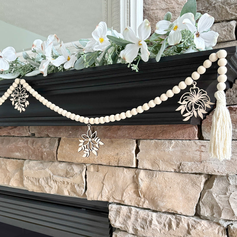 Wood bead garland with flower ornaments