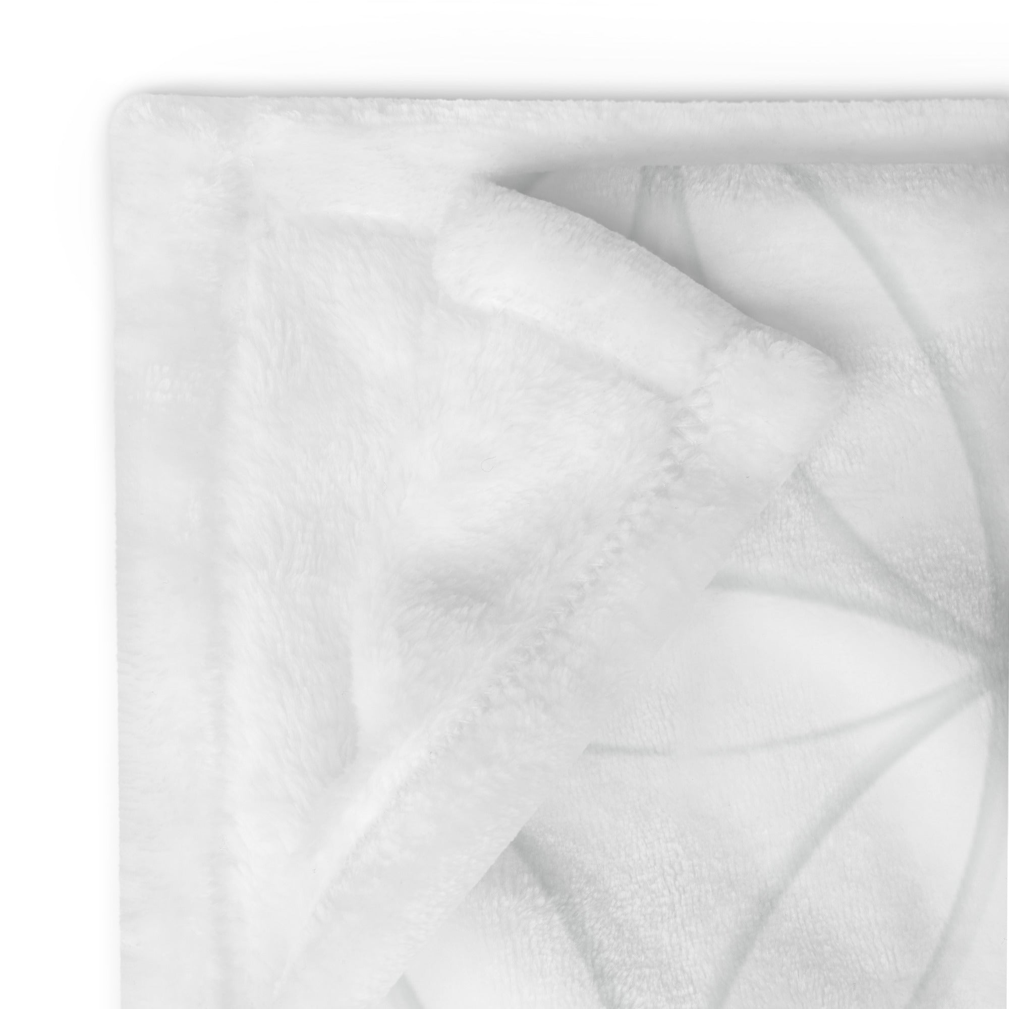 Detailed image of stitching and corner of personalized extra large blanket with light gray contemporary flowers. Blanket has text that says, "a hug from Nicole.” Farewell gift for moving away.
