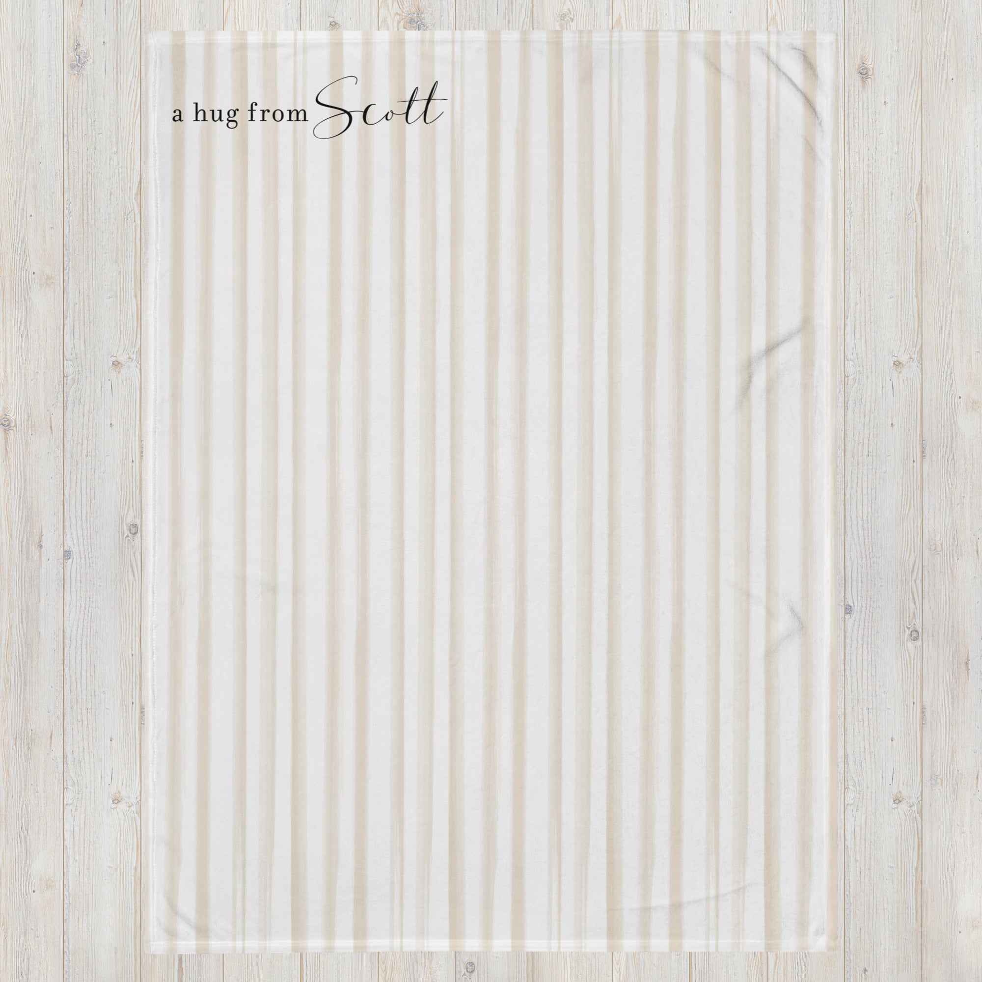 Send a hug support gift blanket with a taupe striped pattern and the words "a hug from” with personalized name. Thinking of you gift for long distance relationship.
