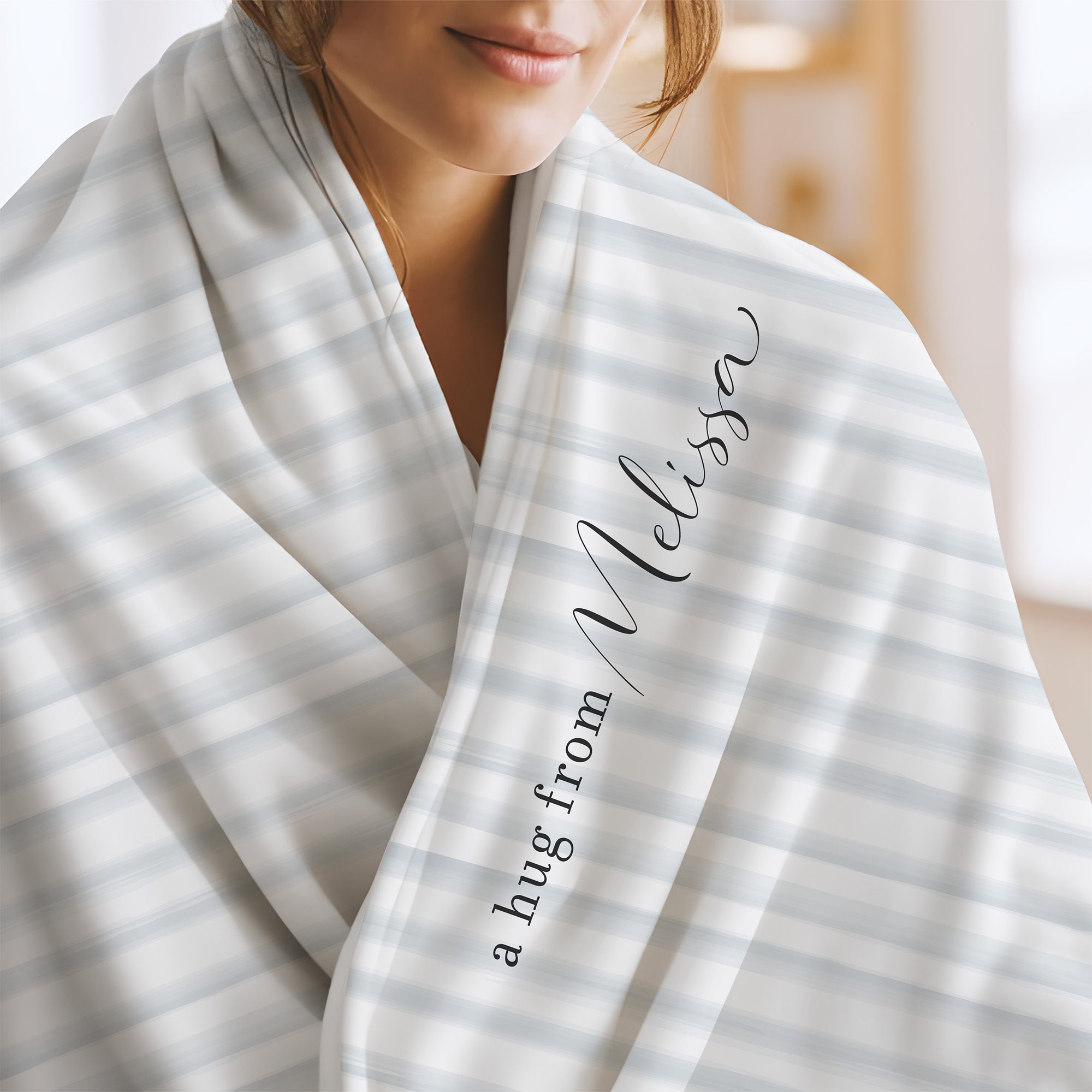 Send a hug extra soft blanket with white and blue modern stripe pattern and the words "a hug from Melissa.” Get well gift for illness diagnosis.
