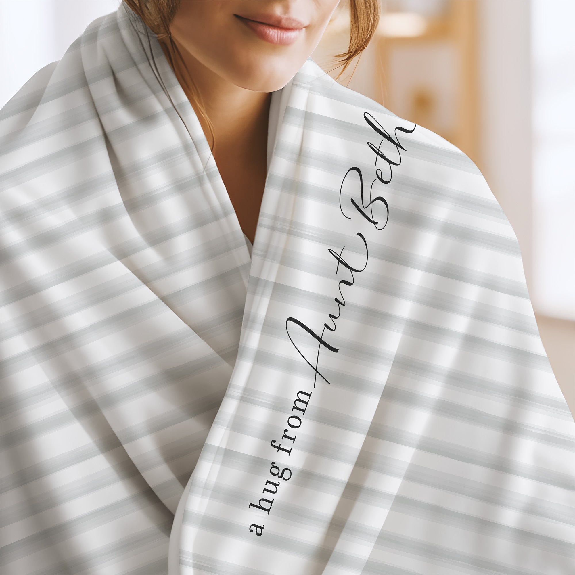 Send a hug extra soft blanket with white and gray geometric stripes and the words "a hug from Aunt Beth.” Encouragement gift for divorce or trauma.

